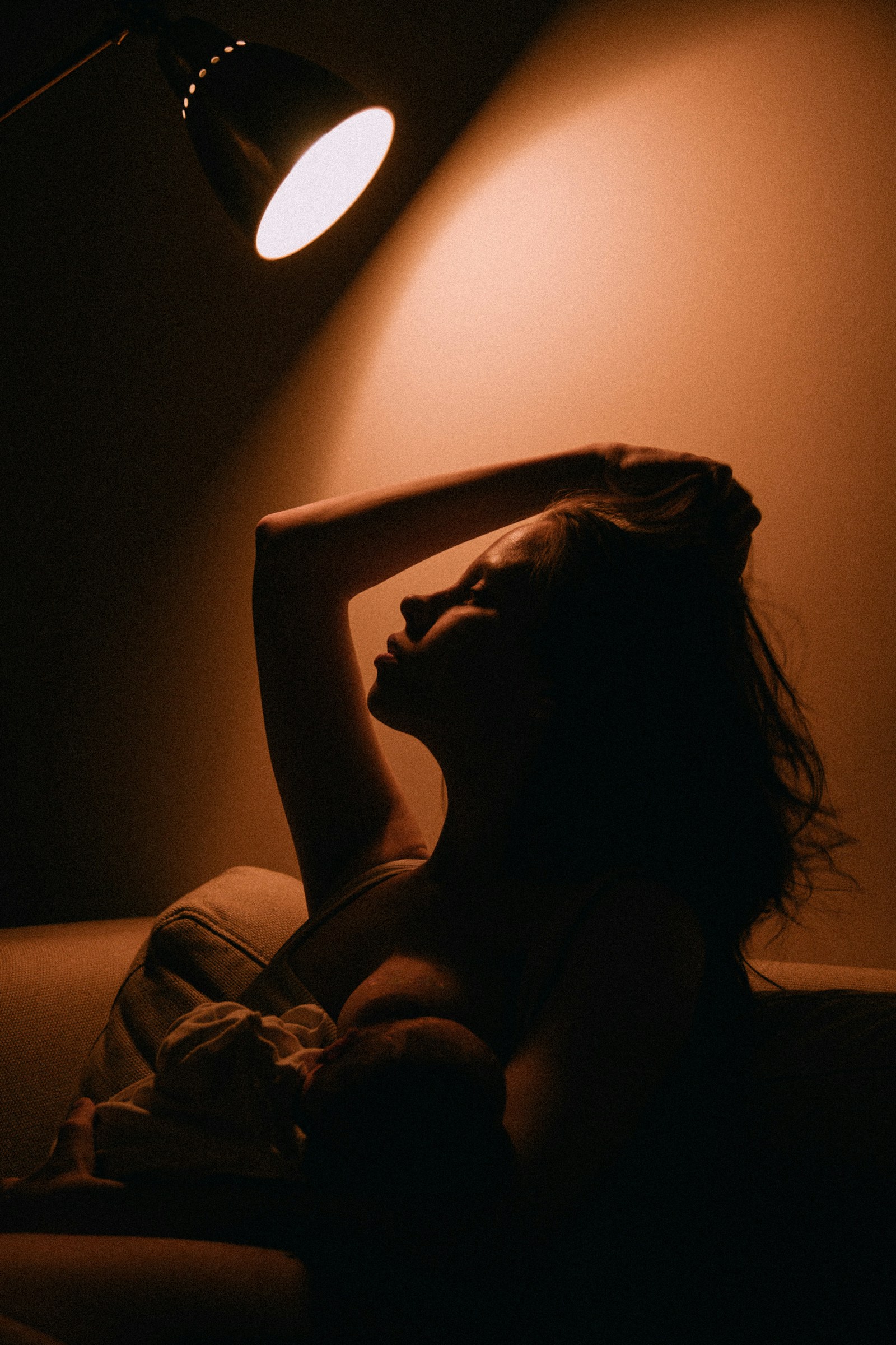 A woman resting in soft natural light — the quiet of the six-week recovery Tenderweeks is built for